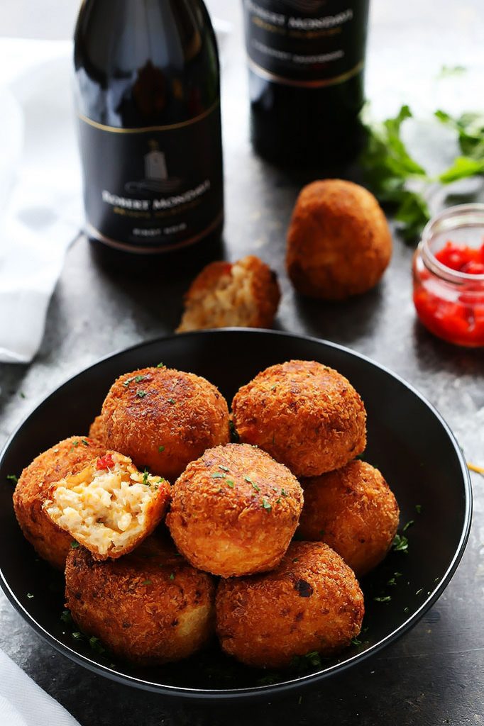 These Pimento Cheese Arancini make a great party appetizer. Creamy risotto & pimento cheese balls are fried until golden & delicious! | platingsandpairings.com