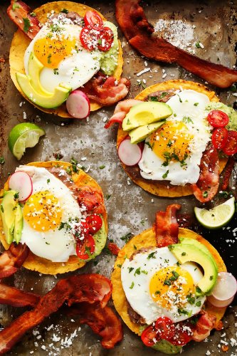 These Bacon Breakfast Tostadas are perfect for serving a group at brunch because everyone can customize their toppings & the style of eggs that they prefer. | platingsandpairings.com