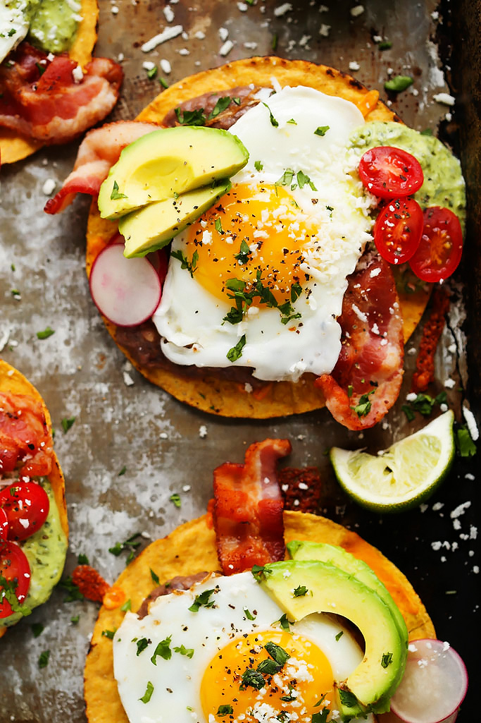 These Bacon Breakfast Tostadas are perfect for serving a group at brunch because everyone can customize their toppings & the style of eggs that they prefer. | platingsandpairings.com