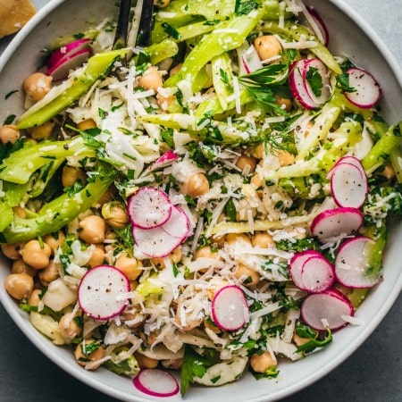 Fennel salad with chickpeas in white bowl.