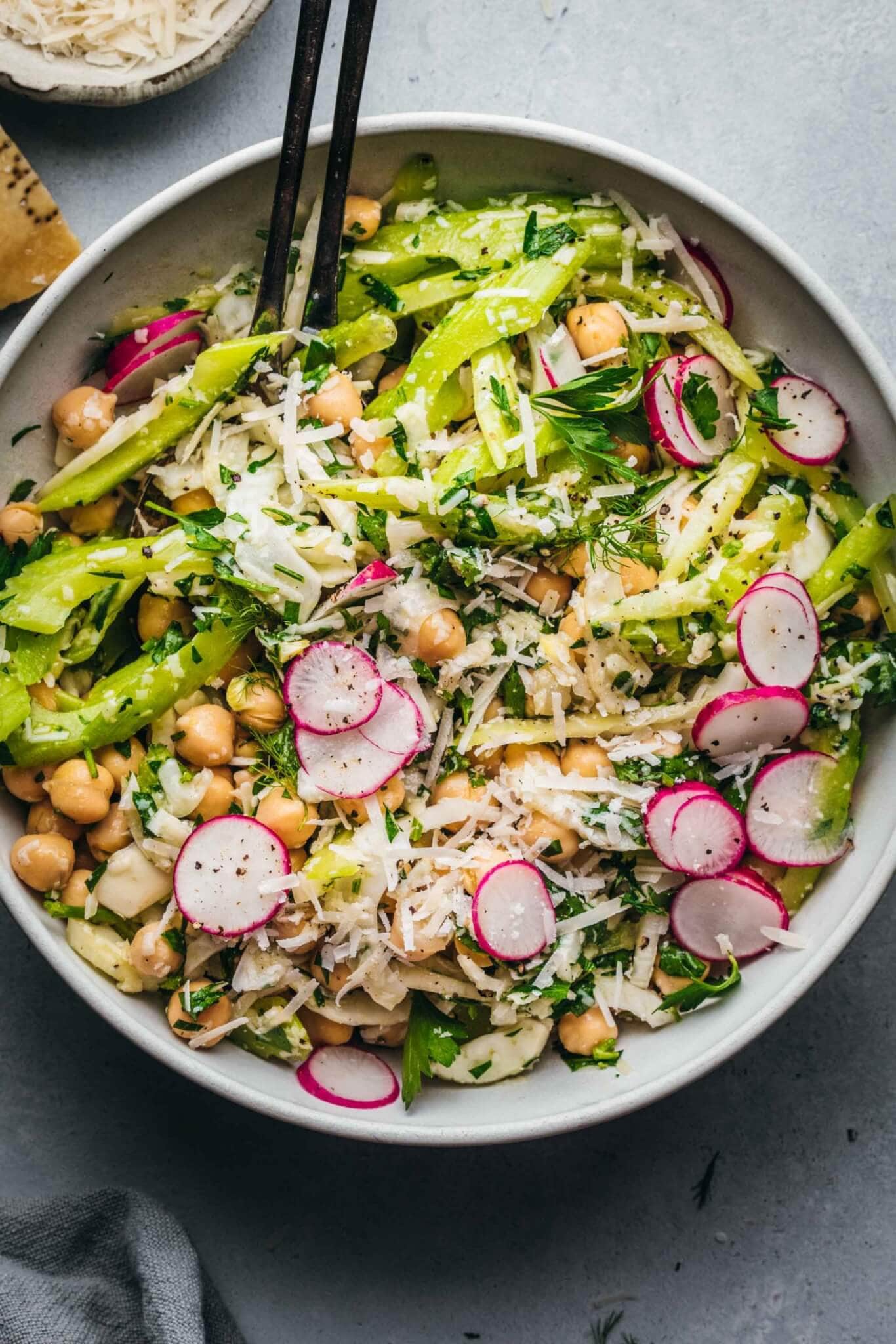 Fennel salad with chickpeas in white bowl.