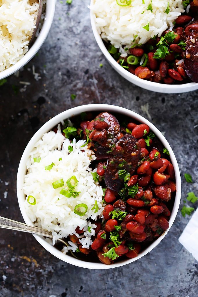 Instant Pot Red Beans & Rice is a traditional New Orleans recipe made with smoked sausage, red beans and cajun seasoning. Plus, with the help of your pressure cooker there's no soaking the beans, meaning that this delicious dinner can be on your table in under an hour! | platingsandpairings.com