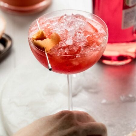 Hand holding grapefruit spritz.