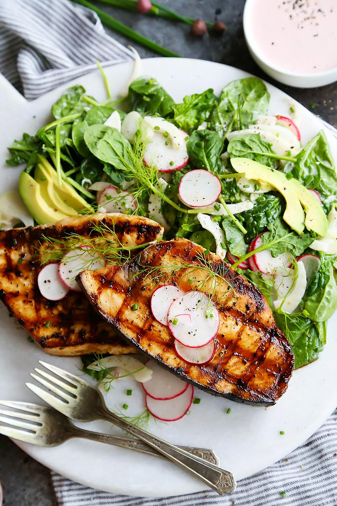 Grilled Swordfish with Tangy Rosé Wine Mayonnaise will take your grilling to the next level. Grilled swordfish is topped with rosé wine mayonnaise that is also turned into a creamy vinaigrette used to dress a simple & refreshing salad of fennel, radish and avocado. | platingsandpairings.com