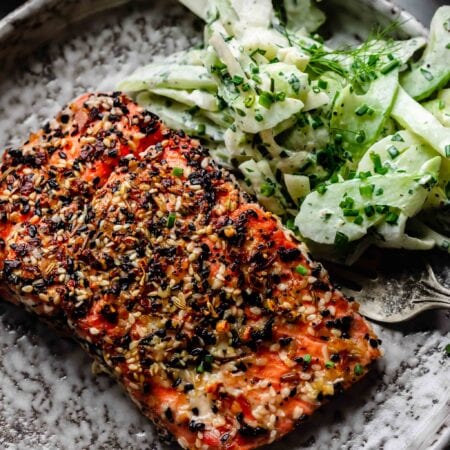 Everything bagel salmon on plate with fennel salad.