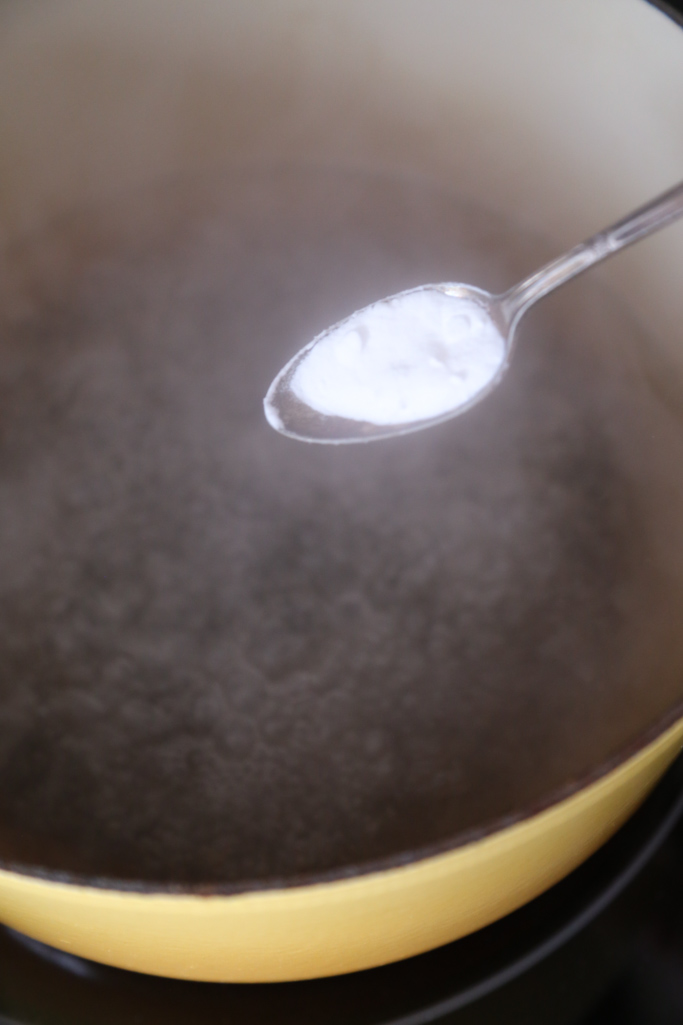 Learn how to clean an enameled cast iron dutch oven with baking soda. It will get rid of any stains and stuck on food without ruining your enameled pot. | platingsandpairings.com