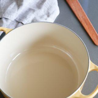 Learn how to clean an enameled cast iron dutch oven with baking soda. It will get rid of any stains and stuck on food without ruining your enameled pot. | platingsandpairings.com