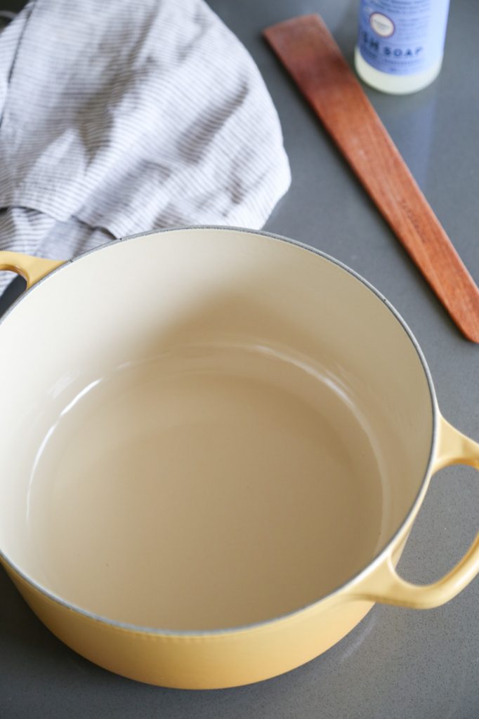 Learn how to clean an enameled cast iron dutch oven with baking soda. It will get rid of any stains and stuck on food without ruining your enameled pot. | platingsandpairings.com