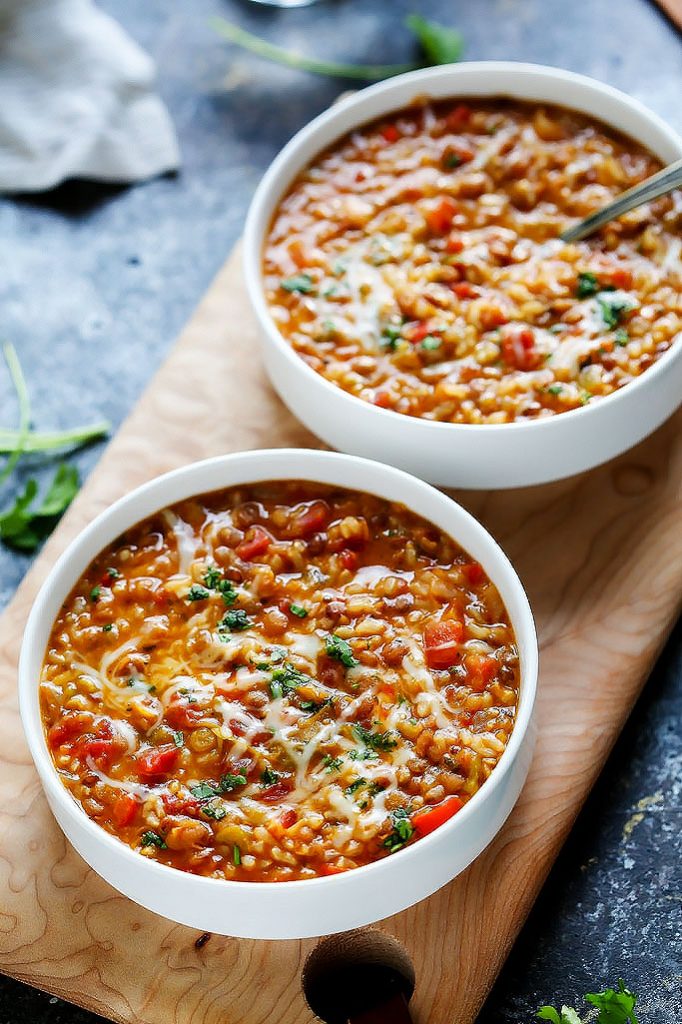 This Instant Pot recipe for Cheesy Southwestern Lentils & Brown Rice is the perfect quick vegetarian weeknight dinner recipe that's perfect for Meatless Monday! Hearty lentils and brown rice combine with southwestern spices, tomatoes, peppers & plenty of melty cheese! | platingsandpairings.com