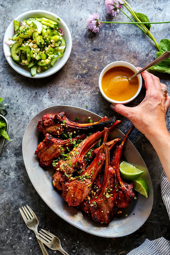 These Lamb Chops with Spicy Peanut Sauce are perfect for your next BBQ. Rich, smoky grilled lamb pairs perfectly with the creamy, tangy Thai-style spicy peanut sauce. It’s a delicious, quick and easy dinner. | platingsandpairings.com
