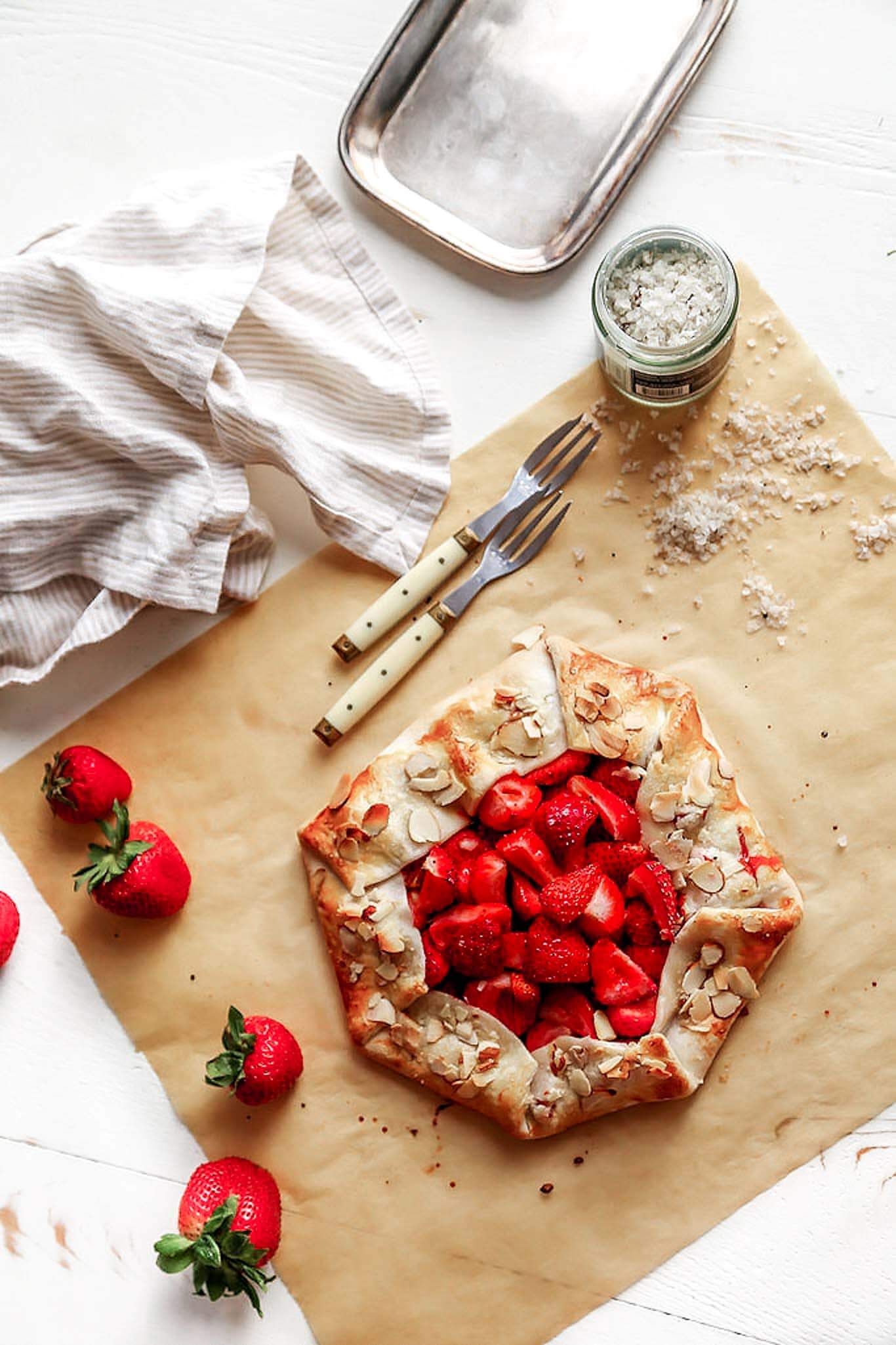 This rustic Strawberry Galette is a quick and easy dessert recipe that can be assembled in just 10 minutes using store-bought, refrigerated pie crust. | platingsandpairings.com