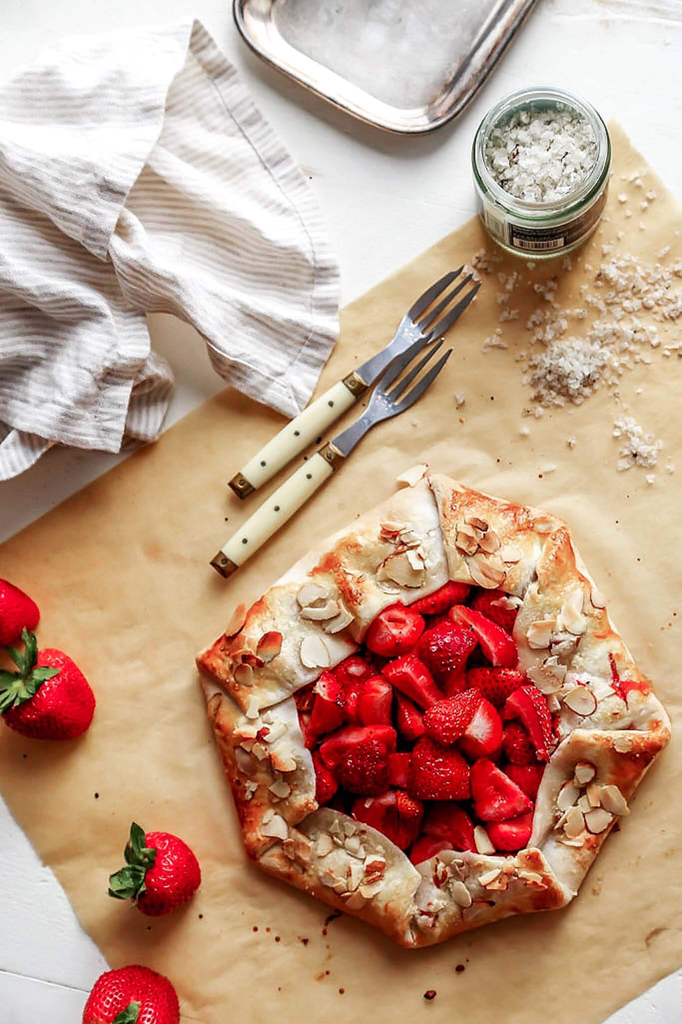 This rustic Strawberry Galette is a quick and easy dessert recipe that can be assembled in just 10 minutes using store-bought, refrigerated pie crust. | platingsandpairings.com