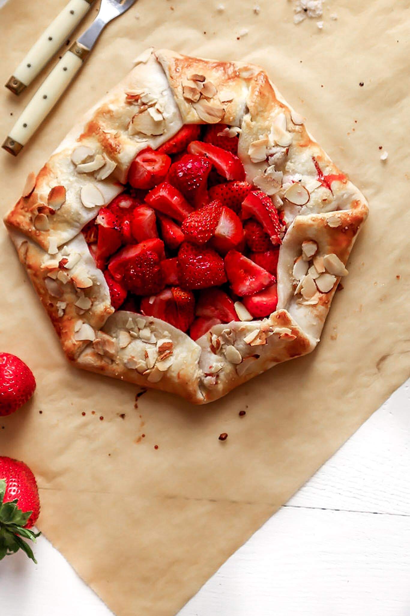 This rustic Strawberry Galette is a quick and easy dessert recipe that can be assembled in just 10 minutes using store-bought, refrigerated pie crust. | platingsandpairings.com