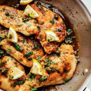 Chicken piccata in skillet.