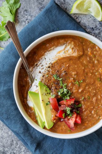 Slow Cooker Chipotle Lentil Soup is a warm and comforting hearty soup that’s perfect for chilly Fall days! The chipotle peppers give it a bit of heat and a great smoky flavor. | platingsandpairings.com
