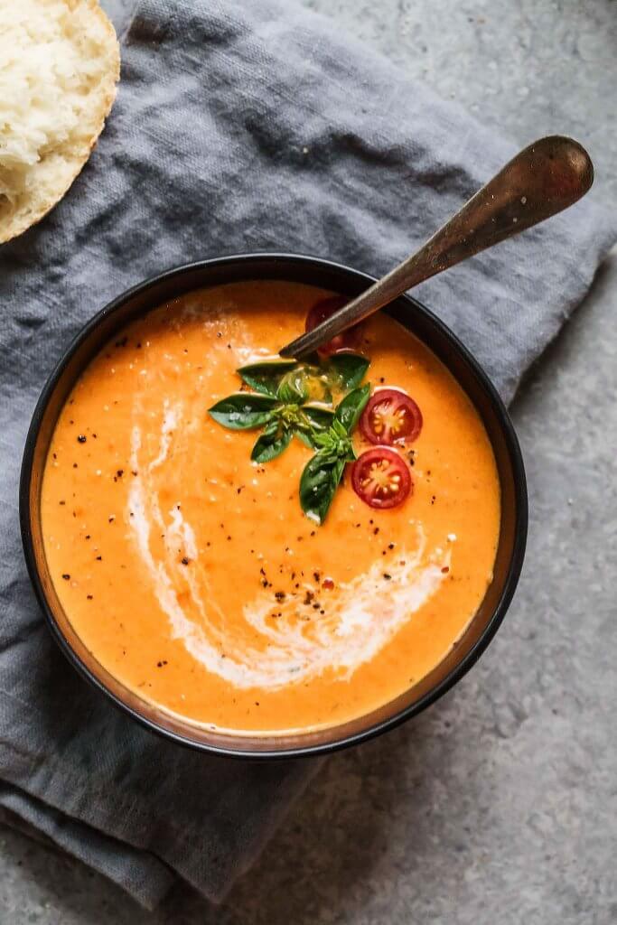 Tomato Orange Soup is the creamiest tomato soup recipe you will find. Plus, it's got a great tang for the orange juice. It's the perfect winter soup for chilly days.