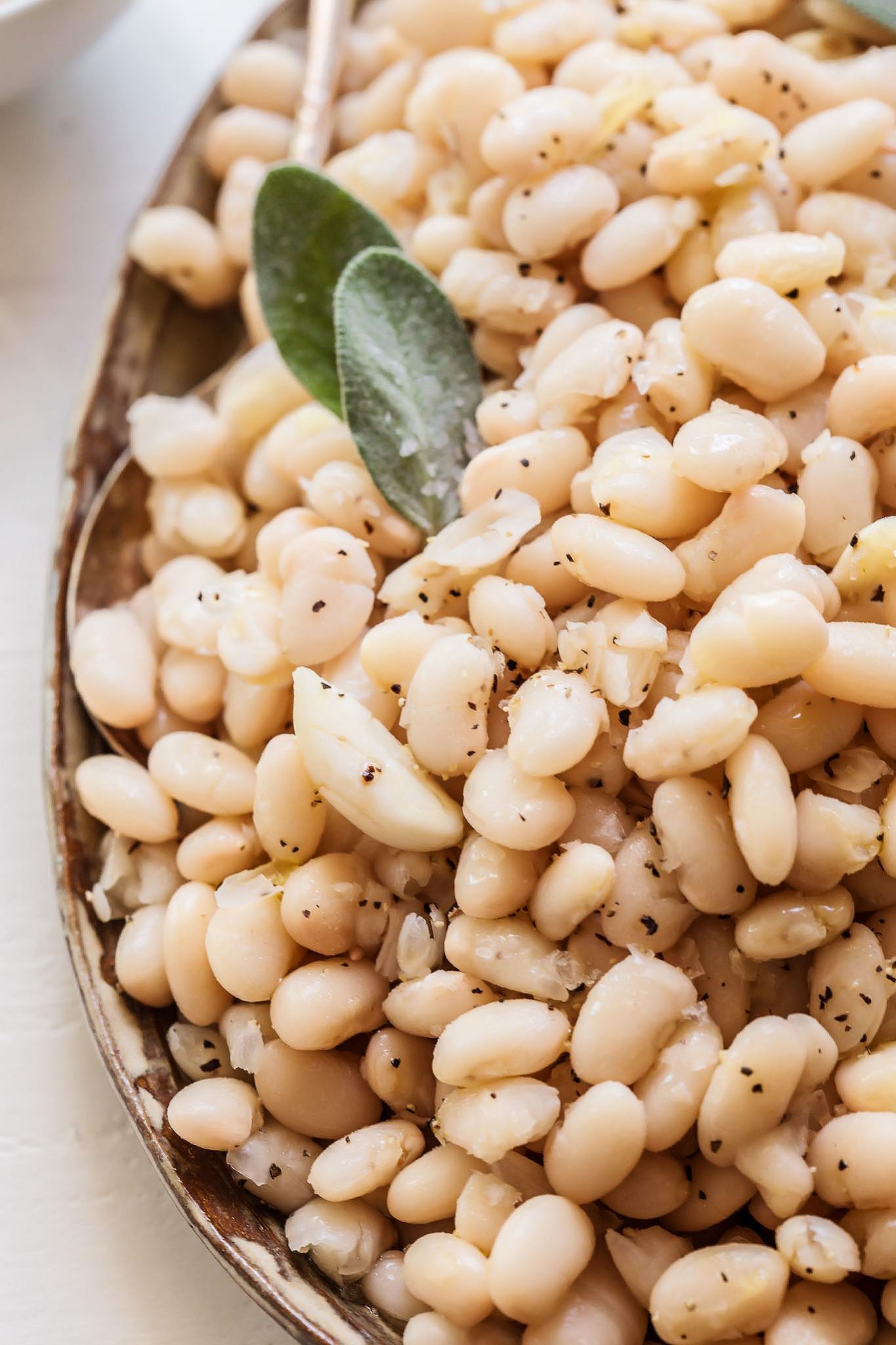 Close up of Italian White Beans with sage.