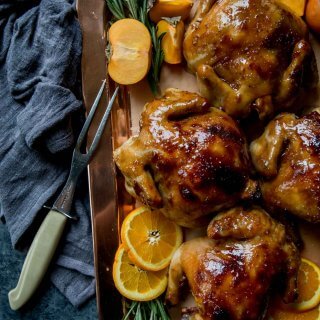 Cornish Game Hens with Apricot Glaze arranged on a platter.