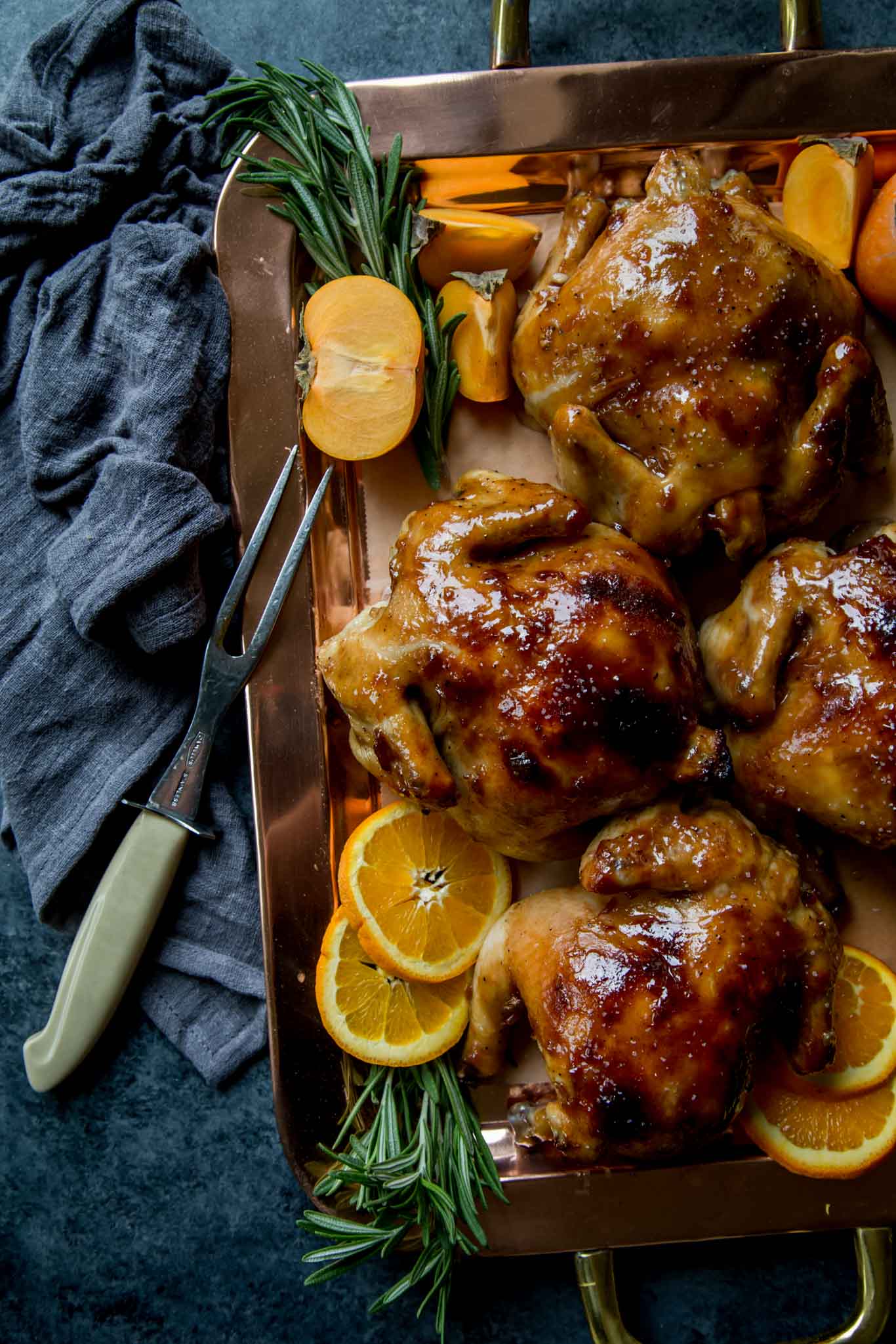 Cornish Game Hens with Apricot Glaze arranged on a platter.