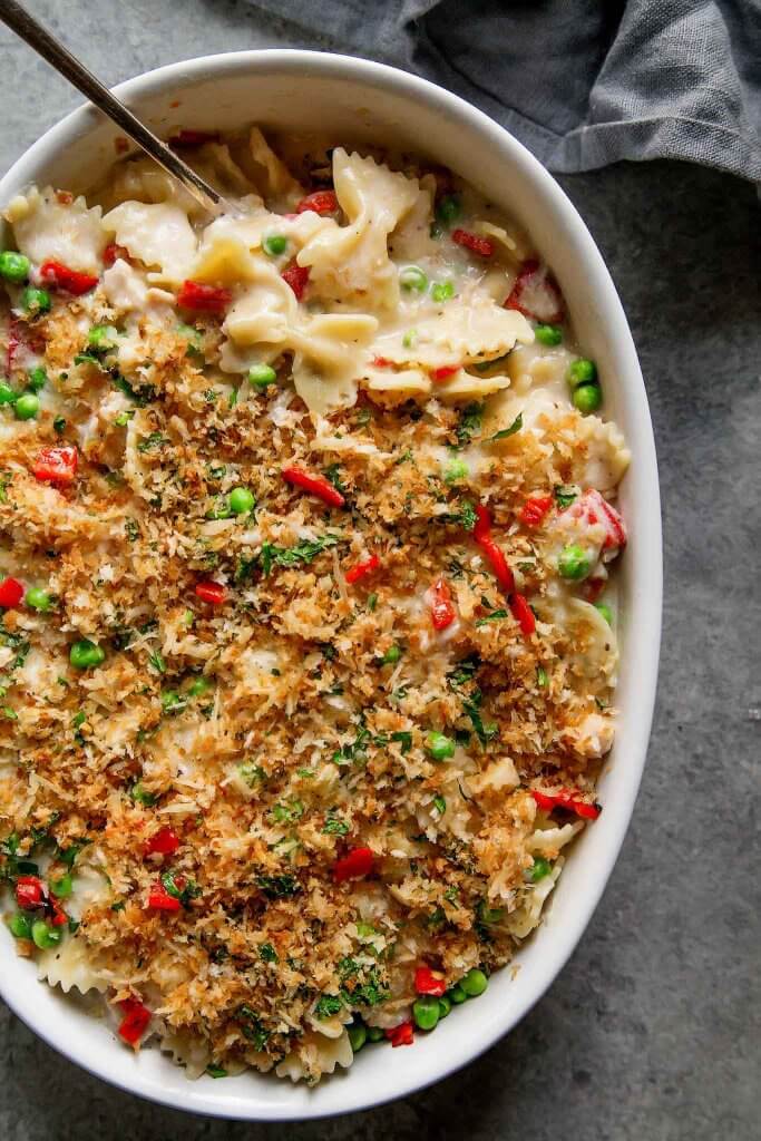 Tuna Noodle Casserole with Gruyere Cheese is an upgraded version of the classic tuna noodle casserole. Spiked with a bit of white wine and topped with buttery parmesan breadcrumbs – Yum! | platingsandpairings.com