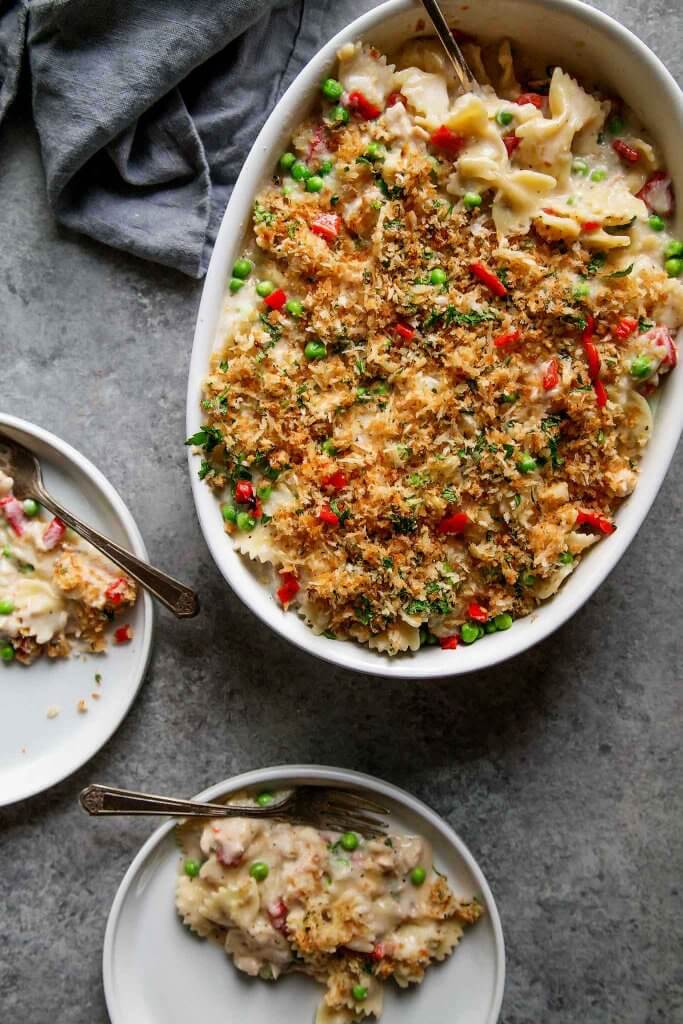 Tuna Noodle Casserole with Gruyere Cheese and Piquillo Peppers is an upgraded version of the classic tuna noodle casserole. Spiked with a bit of white wine and topped with buttery parmesan breadcrumbs – Yum! | platingsandpairings.com
