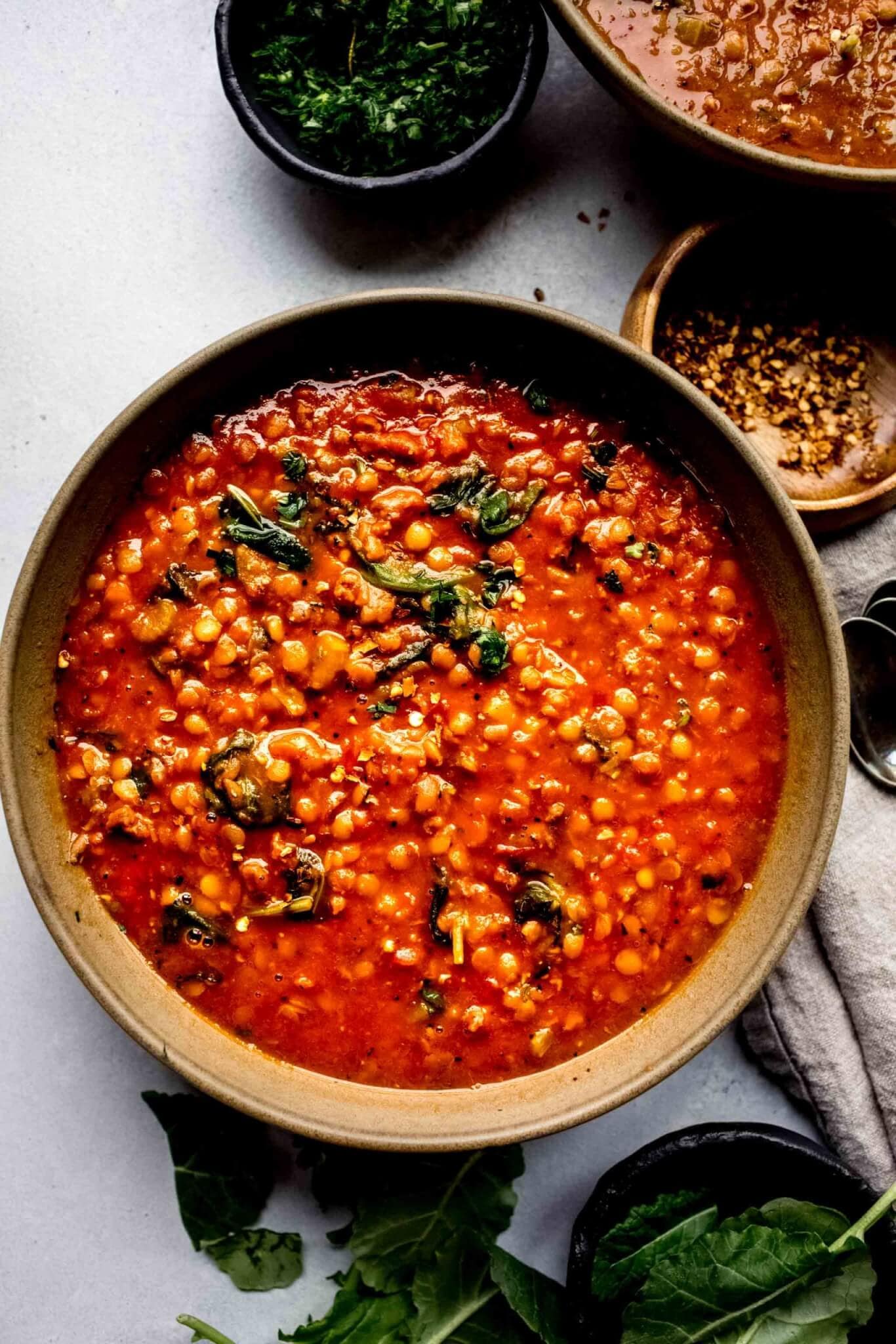 Overhead close up of bowl of lentil soup with spoon.