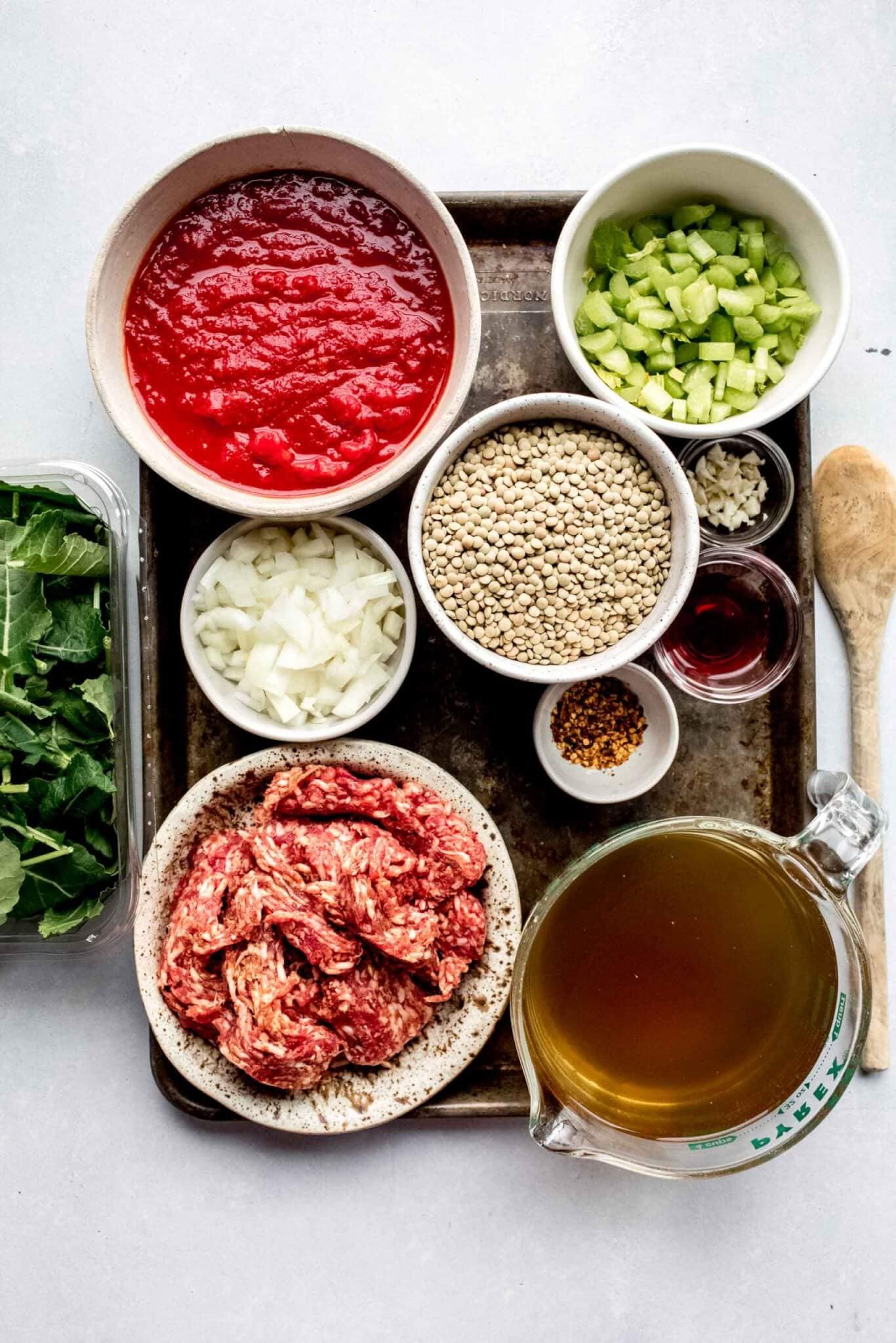 Ingredients for lentil soup on tray.