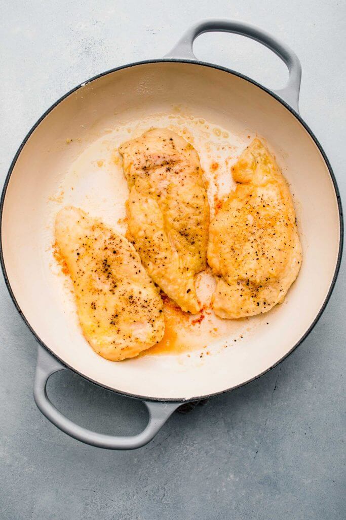 Fried Chicken cutlets in skillet.