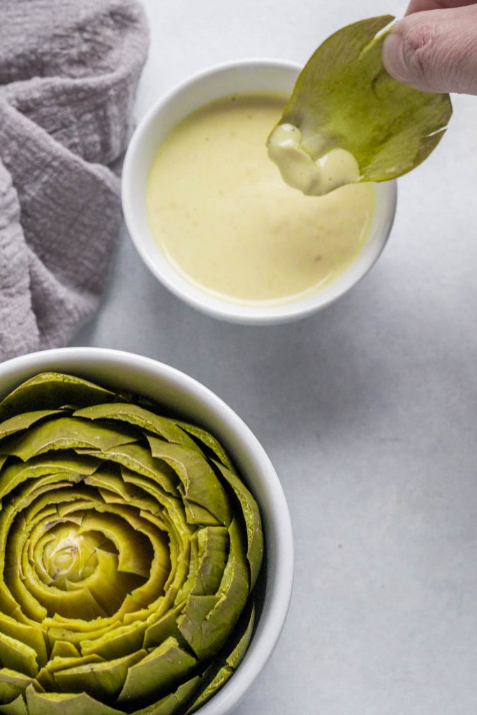 This Artichoke Dipping Sauce is amazing!  It turns even the pickiest eater into a steamed artichoke lover and is made with ingredients that you probably already have on hand - Like magic!