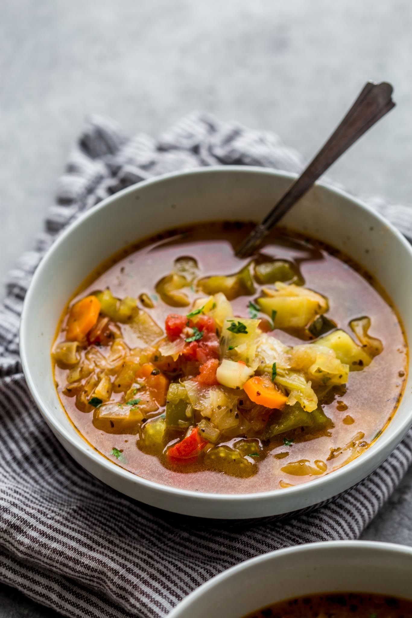 Bowl of Instant Pot Weight Loss Soup with spoon. 