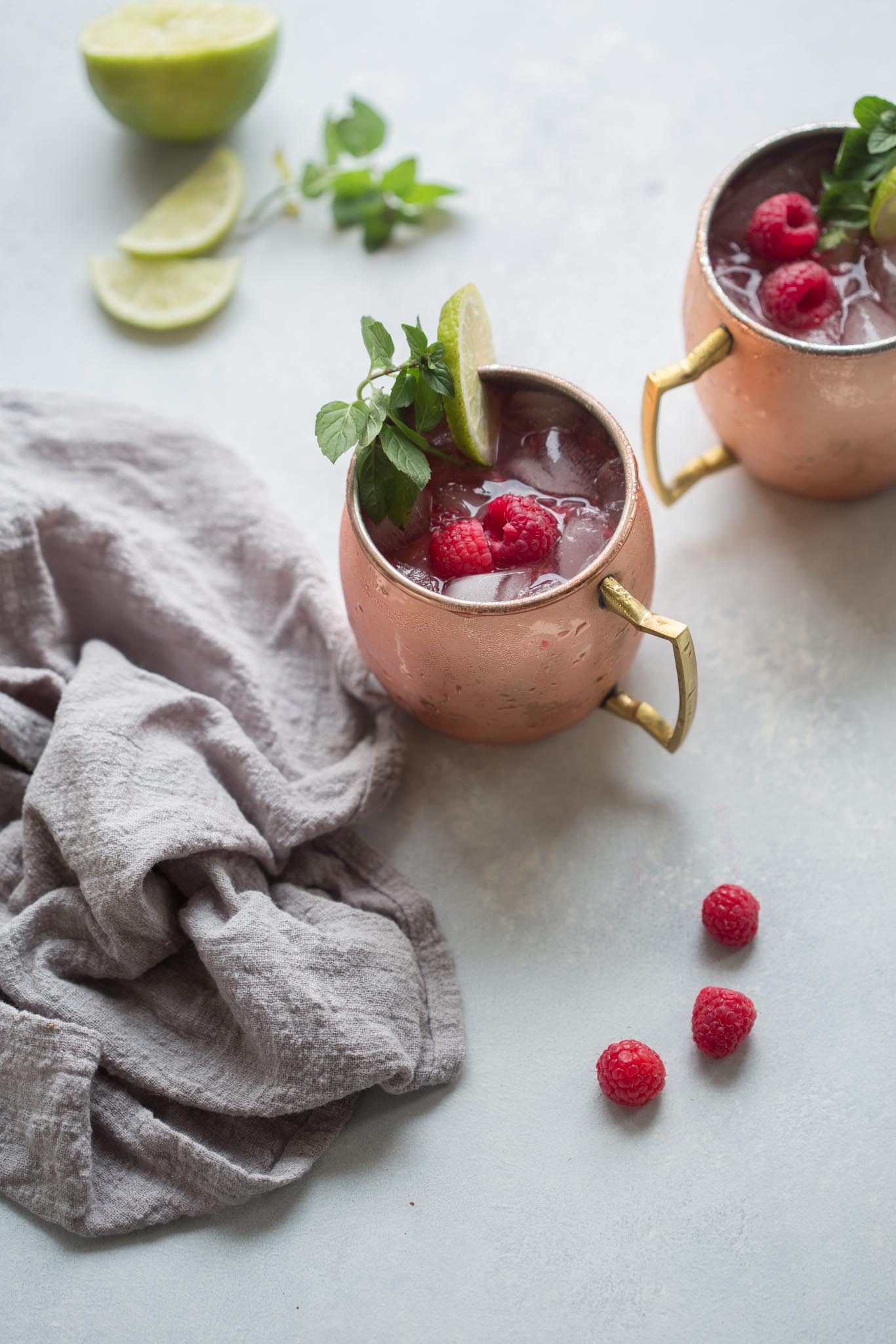 raspberry lime moscow mules in copper mugs