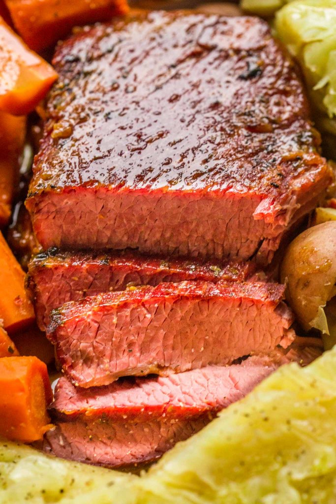 Close up of Slow Cooker Corned Beef & Cabbage arranged on a platter.