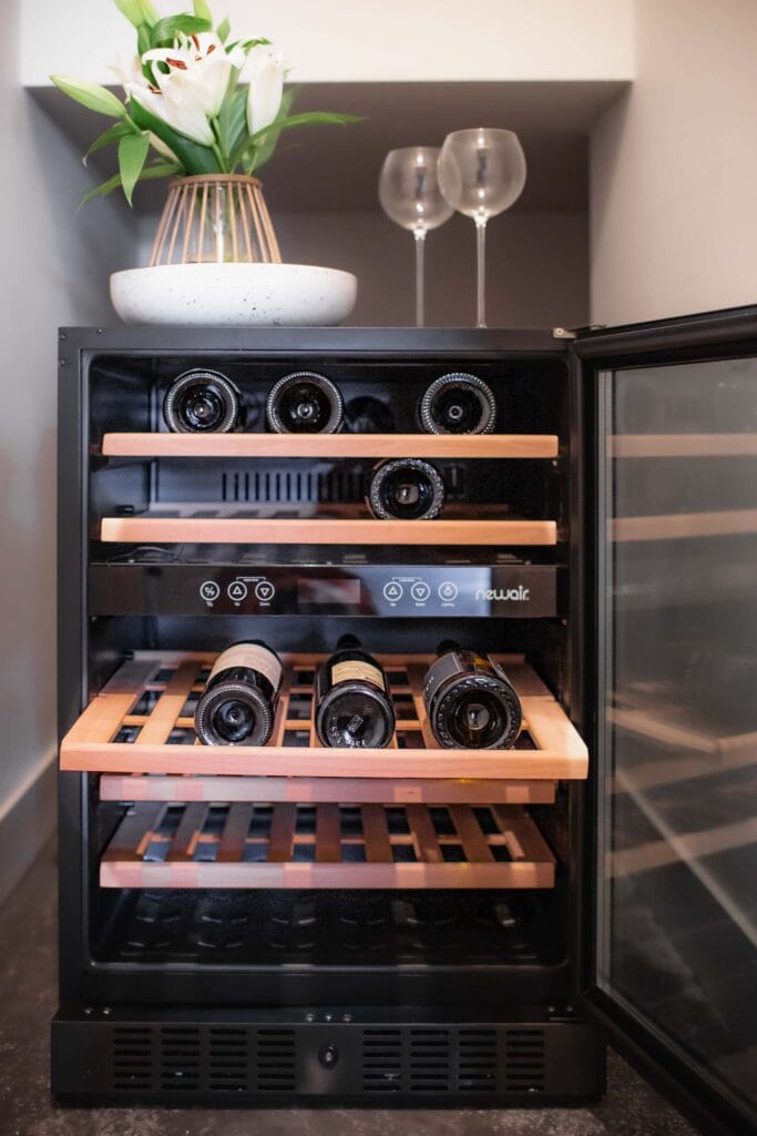 Newair wine cooler with bottles inside. 