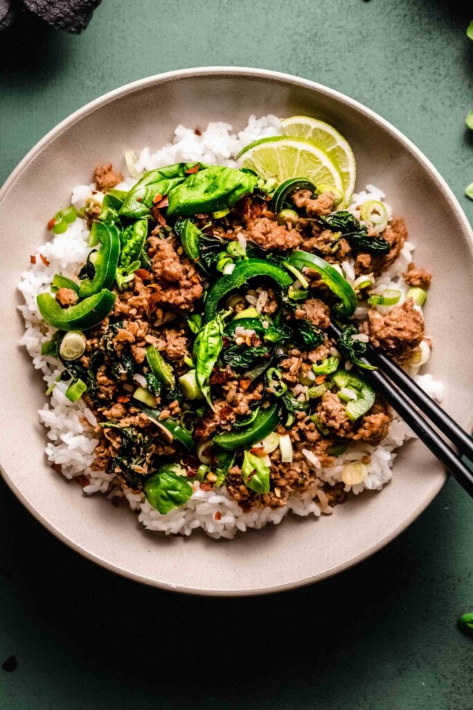 Close up of basil beef in serving dish. 