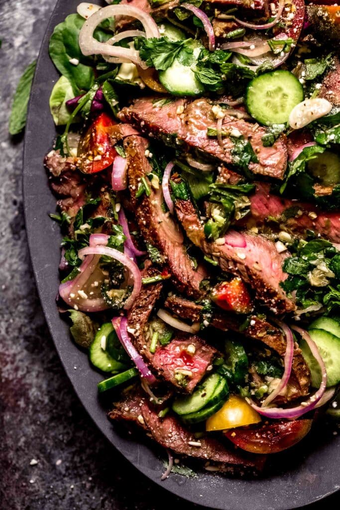 Thai beef salad on serving platter. 