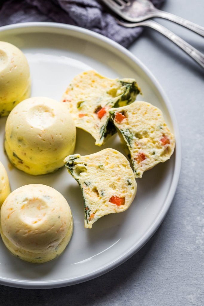 Plate of instant pot sous vide egg bites with some cut in half.