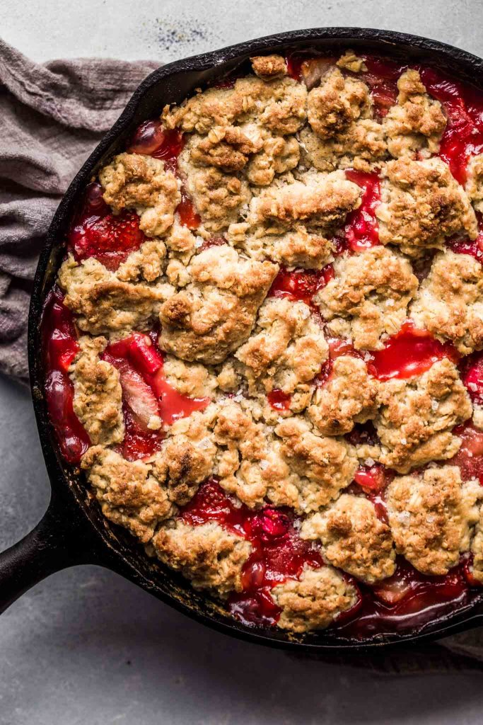 Baked strawberry rhubarb crumble in skillet.