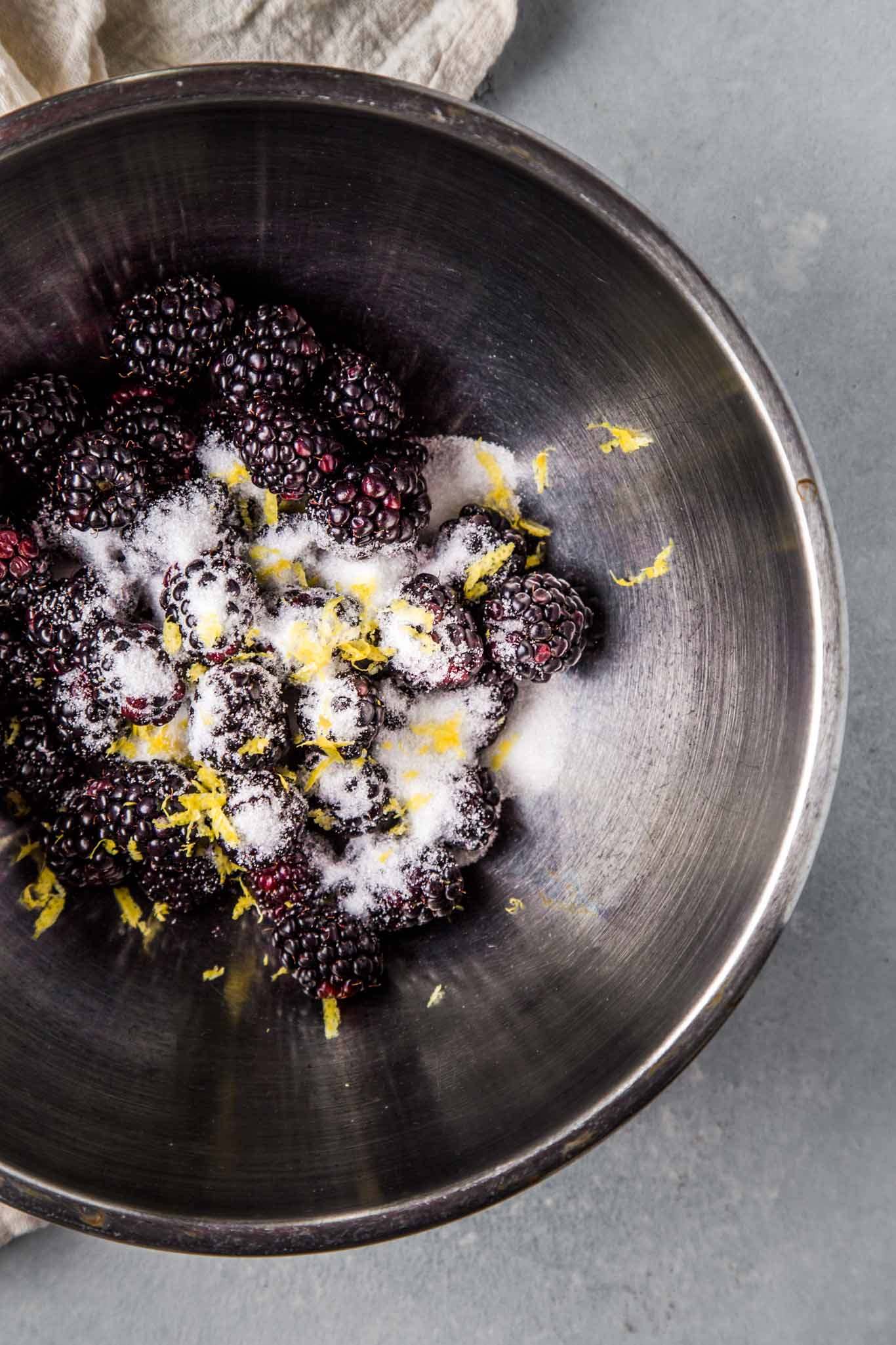 Blackberries tossed with sugar and lemon zest.
