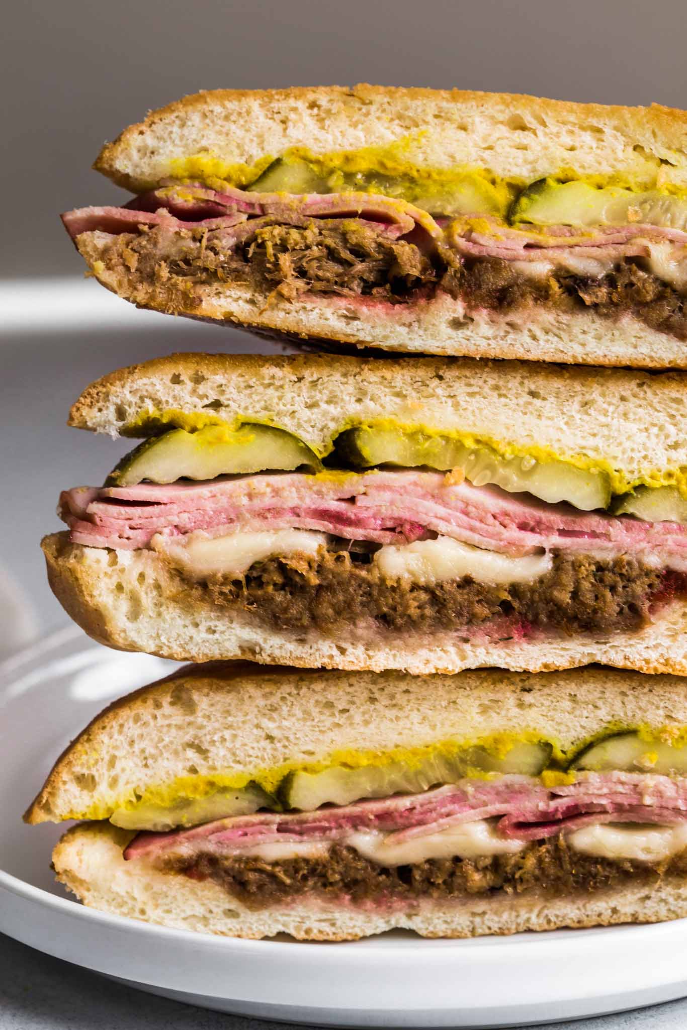 Stack of cubano sandwiches.