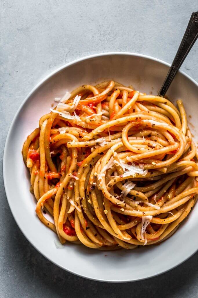 Overhead shot of bowl of pasta with roasted tomato sauce.