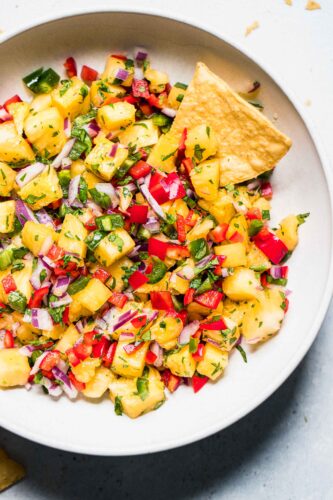 Overhead shot of pineapple salsa in bowl.