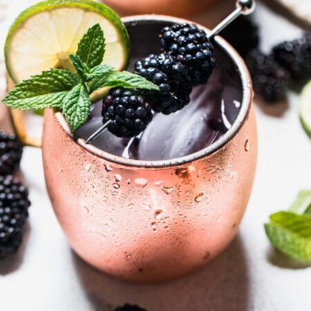 Side view closeup of prepared blackberry moscow mule.