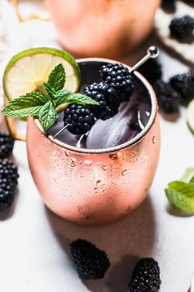 Side view closeup of prepared blackberry moscow mule.