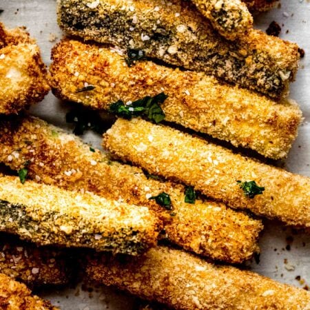 Overhead close up of zucchini fries on platter.