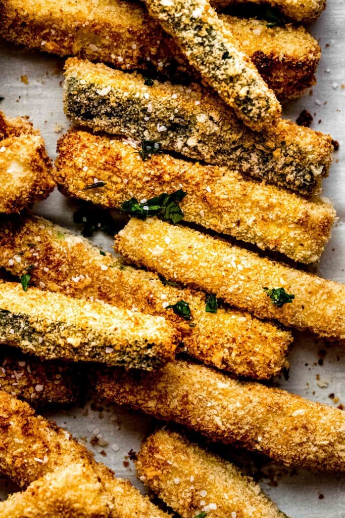 Overhead close up of zucchini fries on platter.