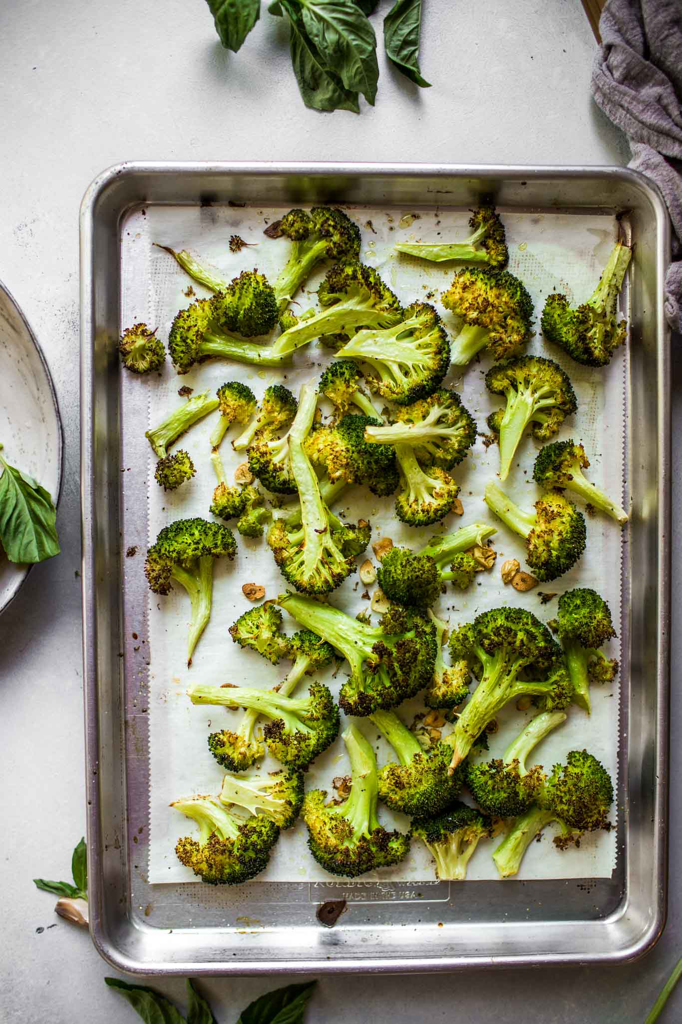 Sheet pan of roasted broccoli with garlic. 