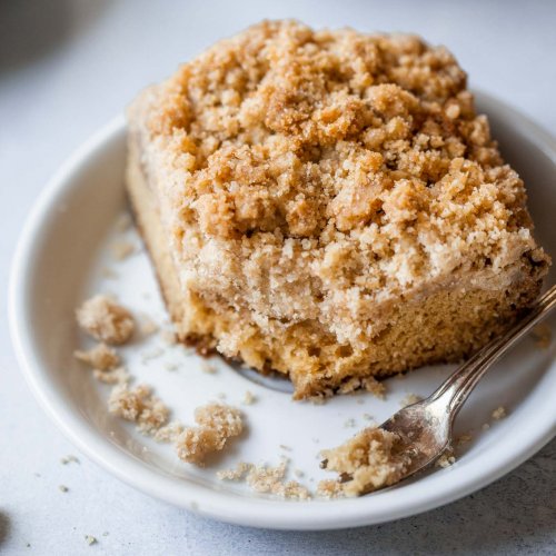 Slice of greek yogurt coffee cake on plate.