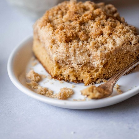 Side view of chai crumb cake with bite taken out of it.