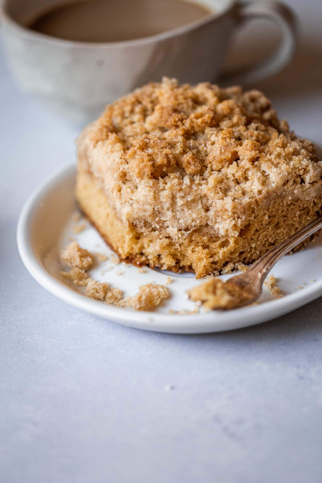 Side view of chai crumb cake with bite taken out of it.