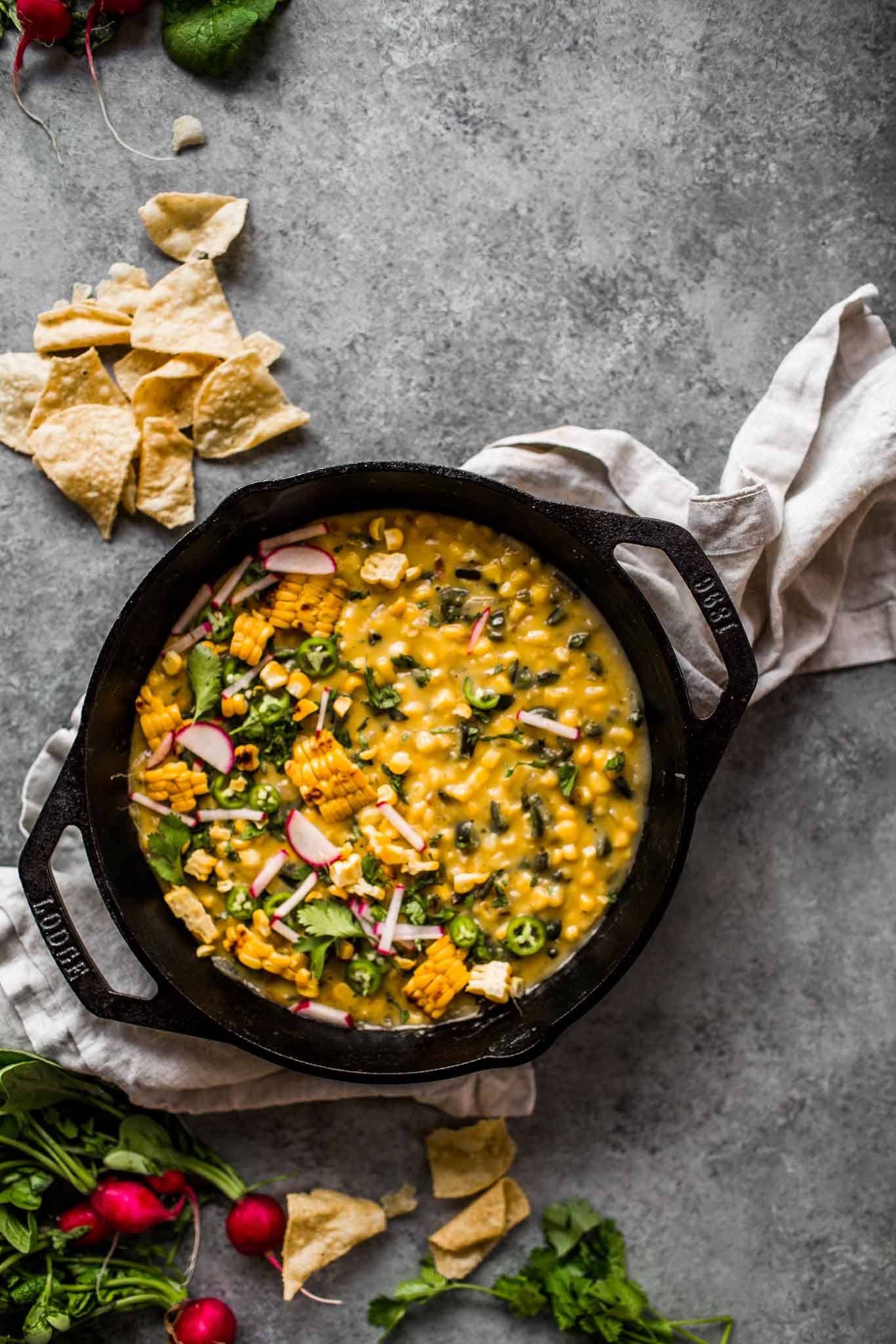 Overhead shot of corn queso dip in skillet.